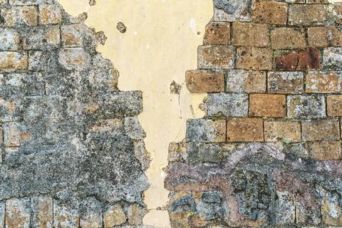 Old brick wall with putty Stock Photos