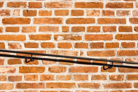 Old brick wall with railing Stock Photos