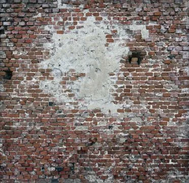 Old brick wall of red blocks with crumbling texture. Stock Photos