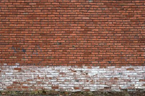 Old brick wall of red blocks with crumbling texture. Stock Photos