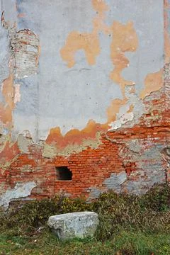 Old brick wall with remnants of plaster Stock Photos