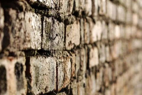 Old brick wall, selective focus Old brick wall background, selective focus... Stock Photos