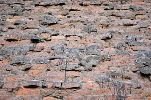 Old brick wall with side. Old walls of an emergency house Stock Photos