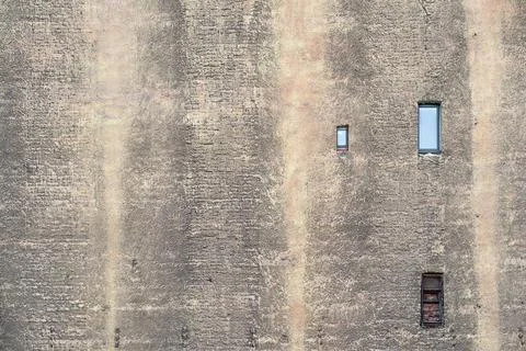 Old brick wall with small windows Stock Photos