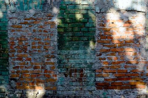 Old brick wall texture background with worn off paint Stock Photos