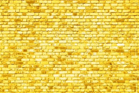 Old  brick wall texture background painted in yellow Stock Photos