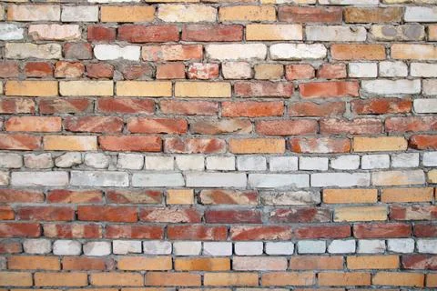Old brick wall texture. Brick wall of historical bricks. Stock Photos