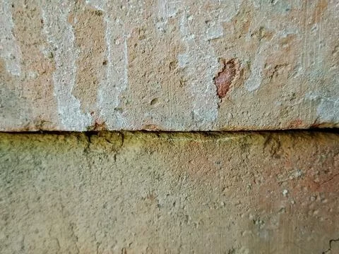 Old brick wall texture with cracks and weathered surface Stock Photos