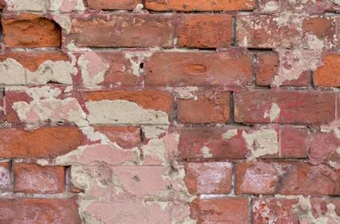 Old brick wall texture. Peeling painted surface. Grunge brickwall. Red stone Stock Photos