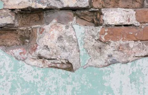 Old brick wall texture. Peeling painted surface. Grunge brickwall. Red stone Stock Photos