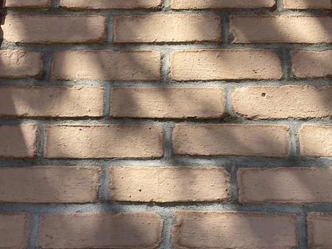 Old brick wall texture with shadows Stock Photos