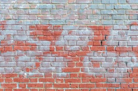Old brick wall with traces of paint. Stock-Fotos