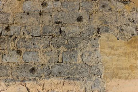 Old brick wall with traces of the shots Stock Photos