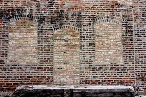 Old Brick Wall with window outlines Stock Photos
