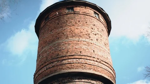 An old brick water tower. Red brick. Very authentic. Old building. Water supply. Stock Footage 128016251