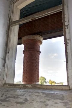 Old brick window openings without glass in the ruins of the old brick Stock Photos