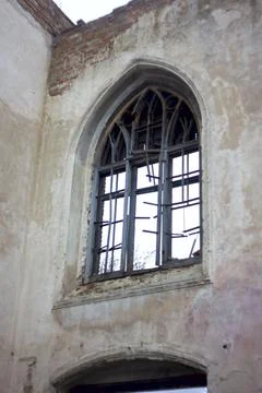 Old brick window openings without glass in the ruins of the old brick Stock Photos