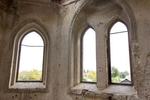 Old brick window openings without glass in the ruins of the old brick Stock Photos