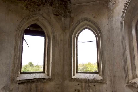Old brick window openings without glass in the ruins of the old brick Stock Photos