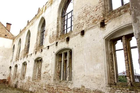 Old brick window openings without glass in the ruins of the old brick Stock Photos