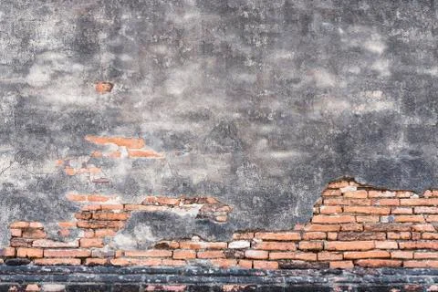 Old bricks pattern and cracked concrete wall for abstract background. Stock Photos