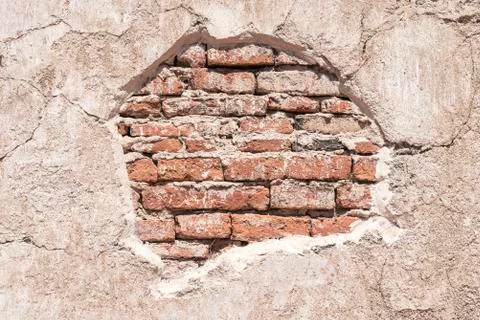 Old bricks pattern on grunge cracked concrete wall. Abstract background. Stock Photos