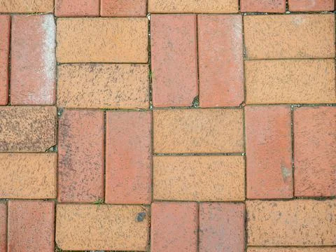 Old brickwork. Bricks on the ground. Construction works. Brick block. Demolit Stock Photos