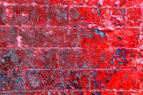 Old brickwork covered with peeling plaster, brick and cement at the joints be Stock Photos