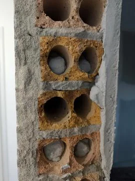 Old brickwork with holes and plaster Stock Photos