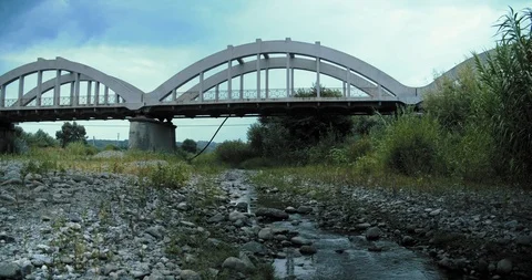 Old bridge and a stream Stock Footage 116608577