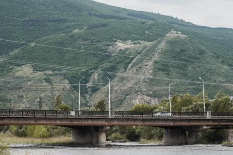 Old bridge on the background of mountains. Temple on the mountain, Stock Photos