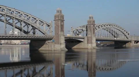 Old bridge with beacon towers reflected in water Stock Footage 62438993