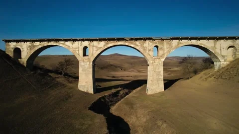 Old bridge. Drone footage of an old railway bridge Stock Footage 240873074