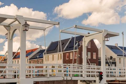 Old bridge in front of new built family homes in Harderwijk, The Netherlands Stock Photos