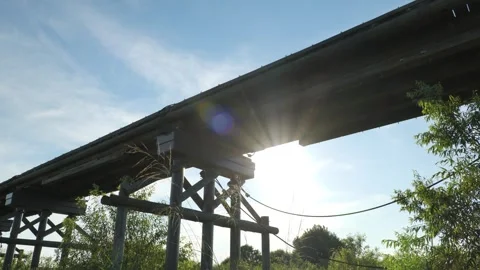 An old bridge in Japan lit up by the setting sun Stock Footage 279122562