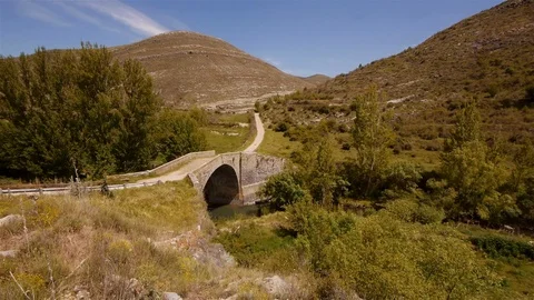 Old Bridge in La Rioja, Spain. Car crossing – wide shot Stock Footage 98013579