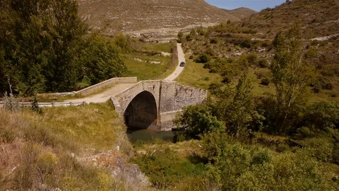 Old Bridge in La Rioja, Spain. Car crossing Stock Footage 98013856