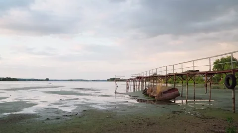 Old bridge on the lake. Panoramic view. The heron takes off and flies away. Stock Footage 246868477