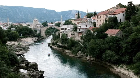 Old bridge in Mostar and river Neretva during the golden hour Video stock 92719646