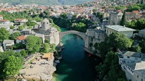 Old Bridge Mostar Drone Video with Mosques, Halebija Tower and Beach Stock Footage 329963237