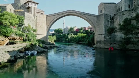 Old Bridge Mostar Frontal Drone Video with Koski Mosque and Halebija Tower Stock Footage 329964445