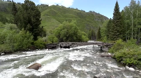 Old bridge on the mountain river 스톡 동영상 49044586