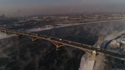The old bridge over the Angara river. Steam is emitted from the wate Stock-Footage 165611544