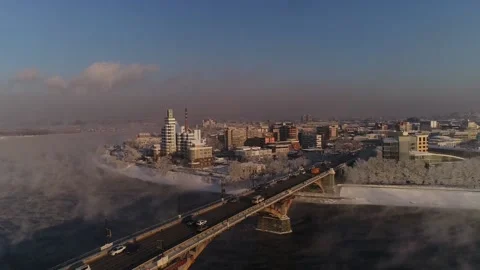The old bridge over the Angara river. Steam is emitted from the wate Stock-Footage 165611574