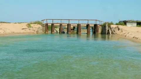 Old bridge over the creek between the black sea and estaury. Eye angle view. Stock Footage 139964953