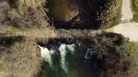 Old bridge over the river  | Aerial Drone Shot Stock Footage 168448103