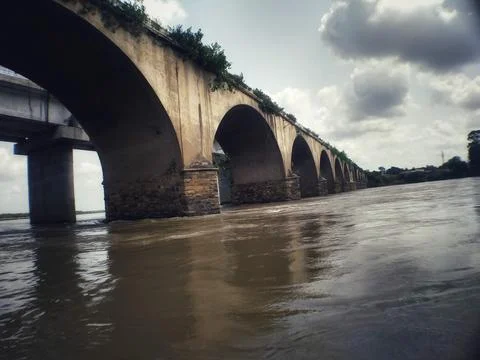 An old bridge over the river Stock Photos