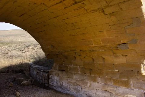 The old bridge over the river in the steppe. Gobustan. Azerbaijan. Stock Photos