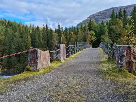 Old bridge over waterfall Stock Photos