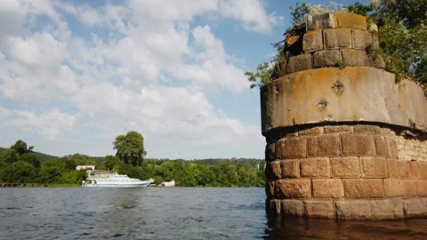 Old bridge pillar in the middle of the river Dnepr in Kiev Stock Footage